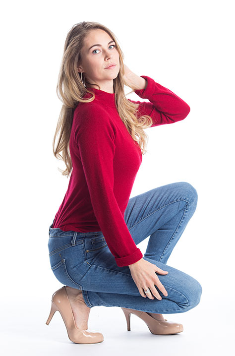 Model kneeling down in photo studio