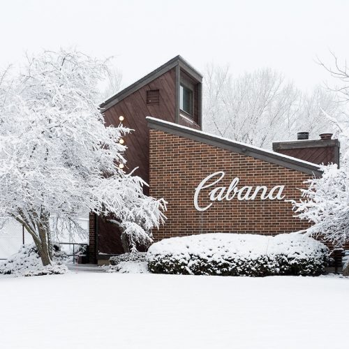 Brown brick cabana covered in fresh snow