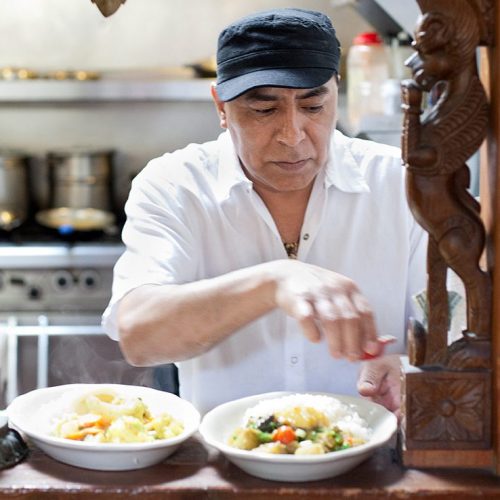 A chef cooking in restaurant kitchen