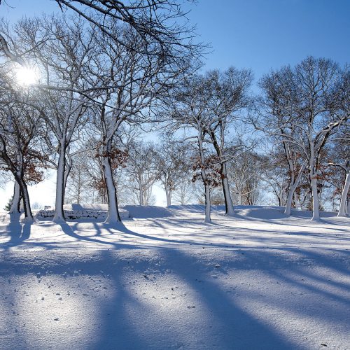 Winter hills landscape with sun