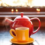 Steaming teapot and mug