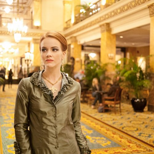 A female traveller in luxurious hotel lobby