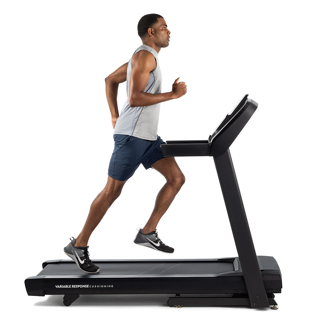 Athlete on fitness equipment treadmill