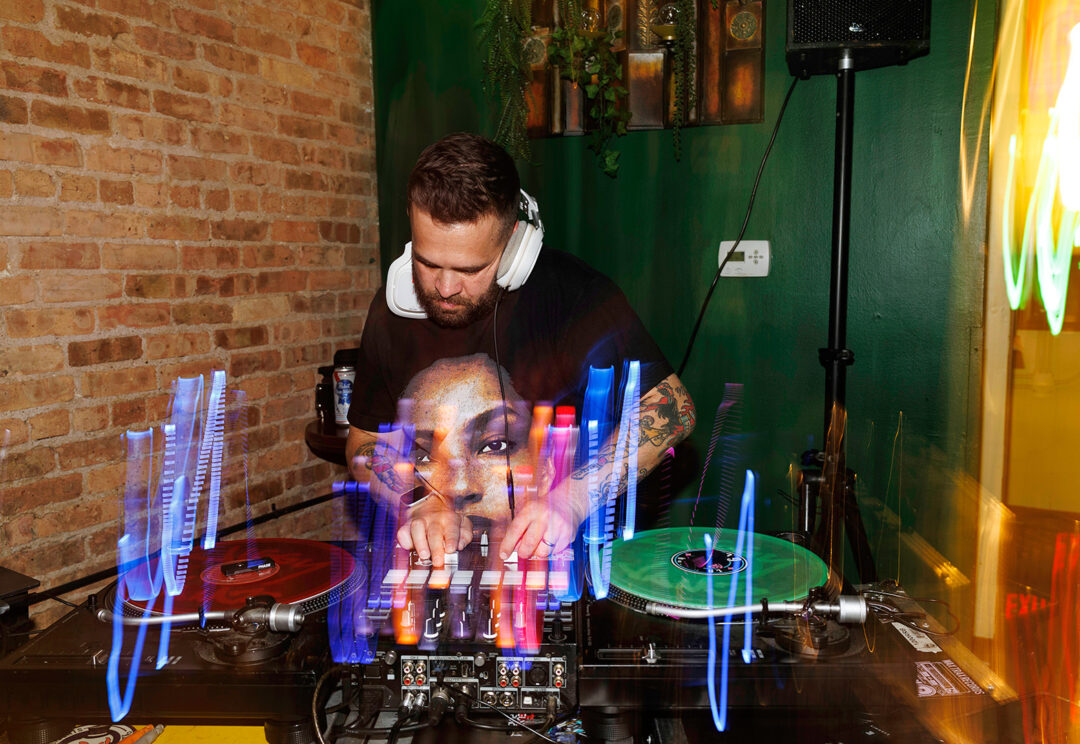 Colorful photo of a DJ spinning